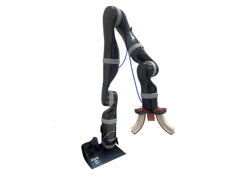 Soft three-finger robotic gripper grasping an object